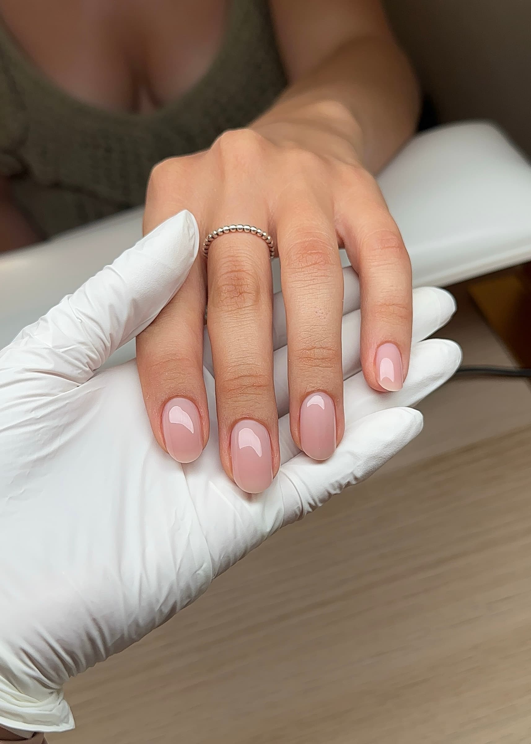 Glossy sheer pink milky manicure on short oval nails